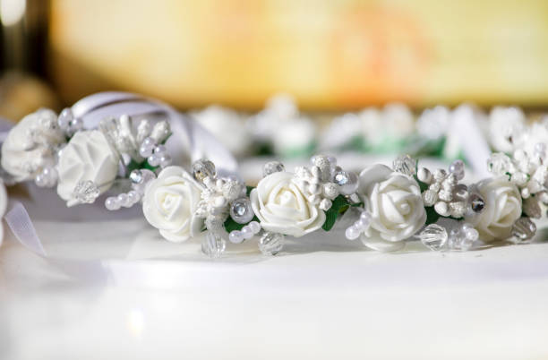istock white festive wreath with artificial flowers on a light background 1320094075