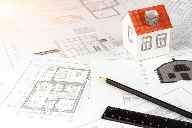 istock Architectural drawings and house concept. Architect Desk. Engineering blueprint. Construction background. Engineering tools. 1320095051