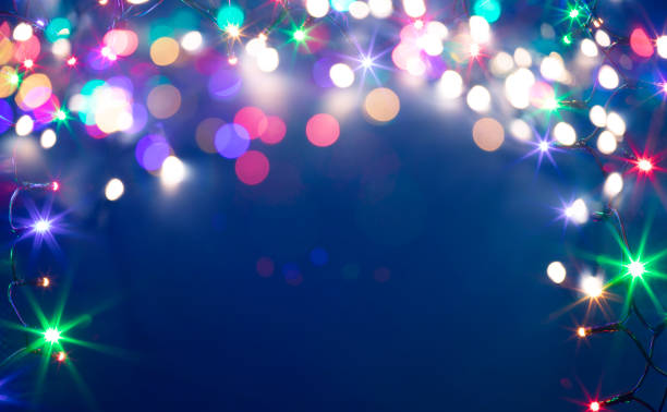 istock Christmas lights over dark blue background 1320096147