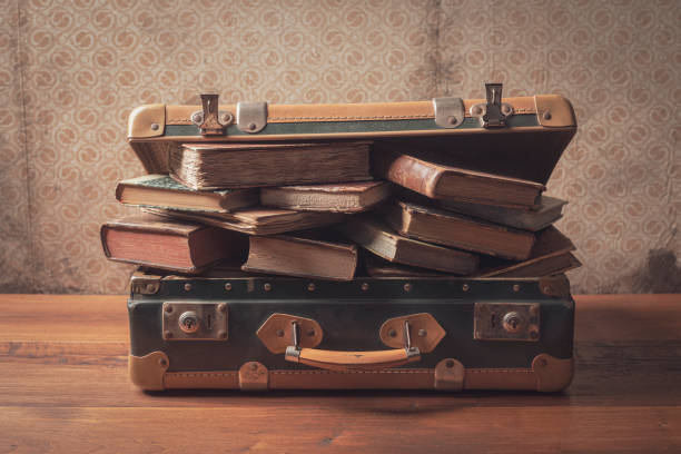 istock Old suitcase full of vintage books 1320097048