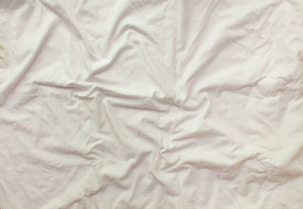 istock Flat layout white background. Modern minimal background with fabric texture and folds of cotton fabric. Top view 1320097231