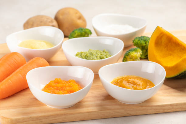 istock Homemade baby food with mashed vegetables 1320101248