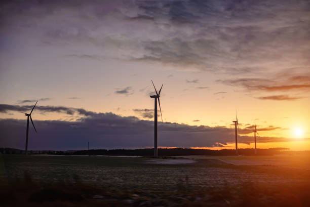 istock Wind power plants in sunlight in winter time. Toning 1320101484