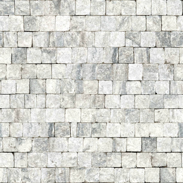 Paving stones - seamless pattern in vector - hyper realistic illustration texture background - floor decoration in natural gray color with square and rectangular shapes - raw stone with an uneven structure strictly arranged in a row Seamless raw uneven surface paved with paving stones. Realistic background with small stones hewn in the shape of cubes and neatly stacked next to each other. V E C T O R file. Zoom to see the details.  S E A M L E S S   P A T T E R N - duplicate its vertically and horizontally to get unlimited area. Pattern great for use in architectural visualizations and graphic backgrounds. brick and stone textures stock illustrations