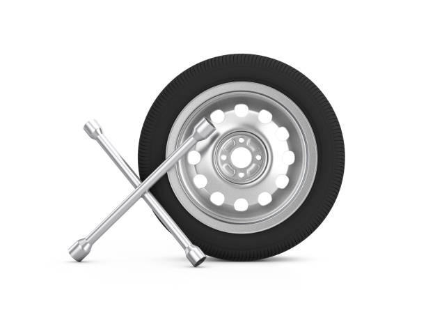 istock Car wheel and cross wrench 1320103080