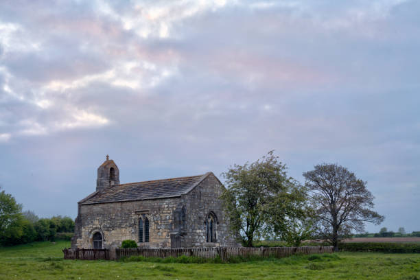 istock Ancient Medieval Church In England 1320104643
