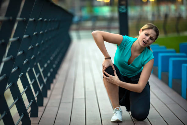 istock Young Woman Suffered a Knee Injury During Morning Exercise 1320106823