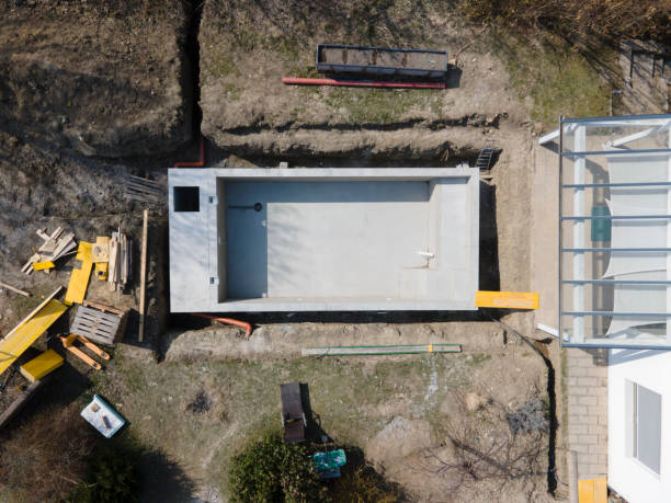 istock Drone shot of pool construction site where the pool is already finished filled, plastered without foil 1320107891