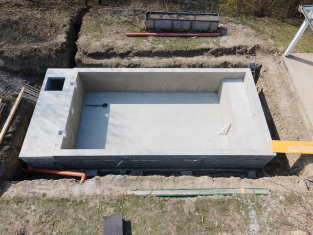 istock Drone shot of pool construction site where the pool is already finished filled, plastered without foil 1320107982