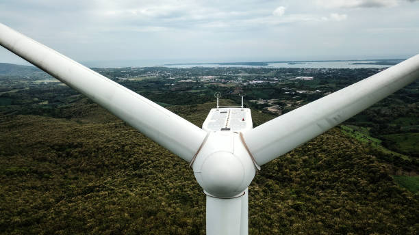 istock Wind Turbines On The Hilly Area under Blue Sky 1320108995