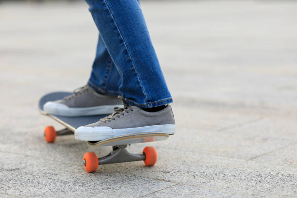 istock Skateboarder legs skateboarding at outdoors 1320109422