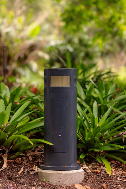 istock Lamp along a path in a public park 1320109440