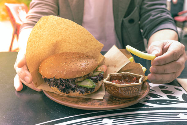 istock High-calorie lunch with a large sandwich 1320110253
