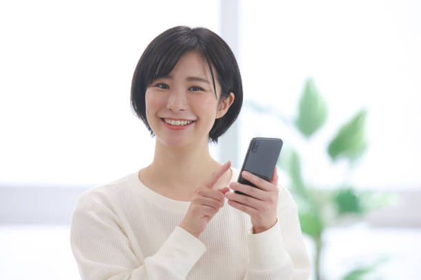 istock Female employee operating a smartphone 1320112280