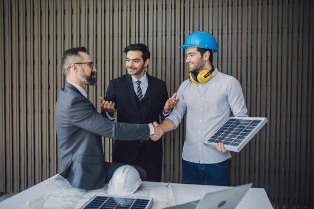 istock Engineer manager and foreman or leader discussion  site project solar cell on workplace. Teamwork, solar energy concept. Two young man architect on a building construction site. 1320115826