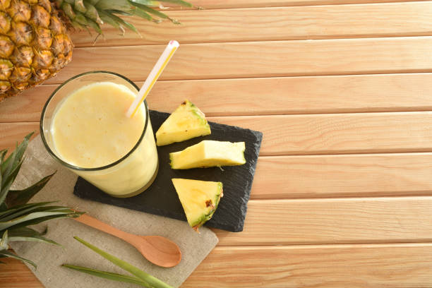 istock Two glasses with pineapple juice top view. 1320117444