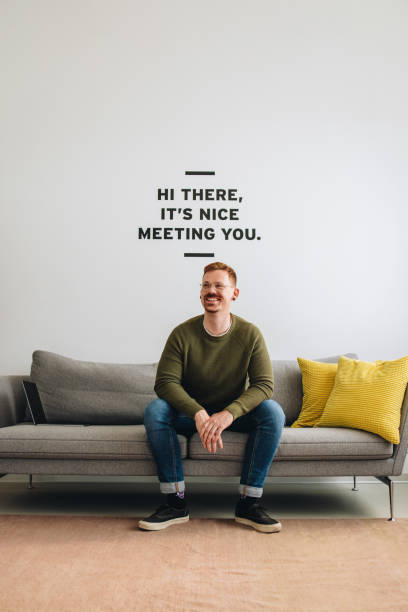 istock Happy freelancer looking away at office lobby 1320118181