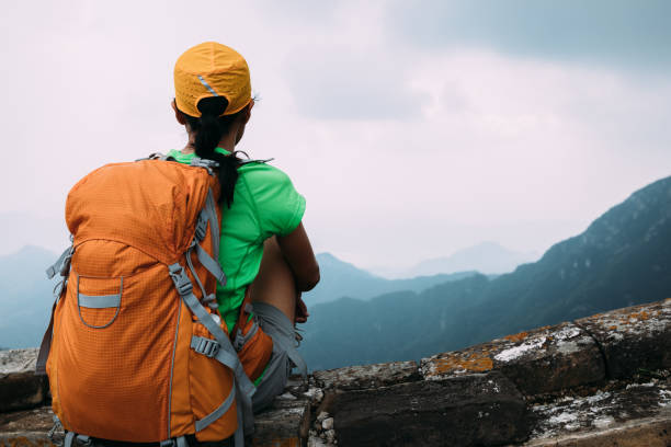 istock Successful female hiker enjoy the view on great wall 1320118770
