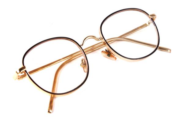 istock Beautiful gold glasses, isolated on white background 1320118999