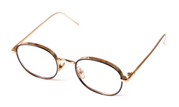 istock Beautiful gold glasses, isolated on white background 1320119822