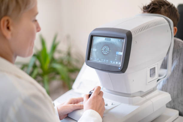 istock Ophthalmologist performing an eye test on a boy 1320125792
