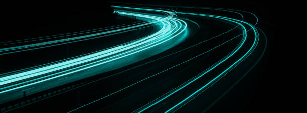 istock blue car lights at night. long exposure 1320126829