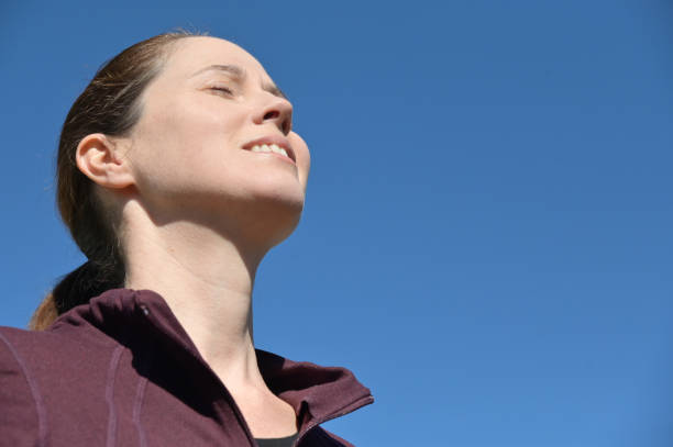 istock Happy woman breathing clean fresh air 1320127084