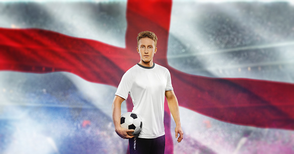 England soccer player holding ball and looking at camera