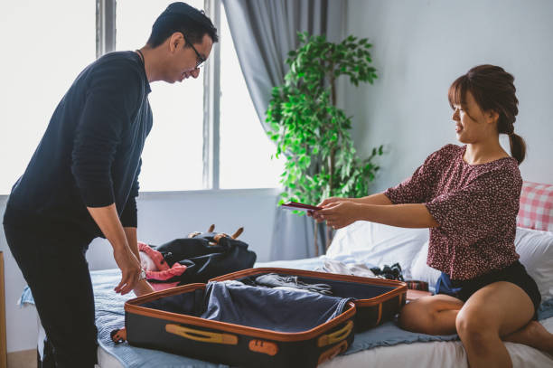 istock Couple preparing for travel 1320130728