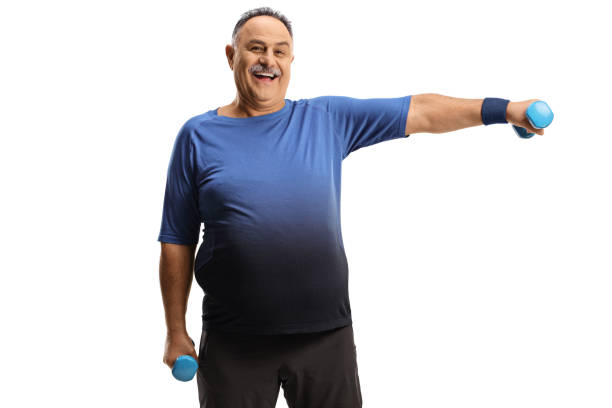 Mature man exercising with dumbbells and smiling Mature man exercising with dumbbells and smiling isolated on white background chubby arab stock pictures, royalty-free photos & images