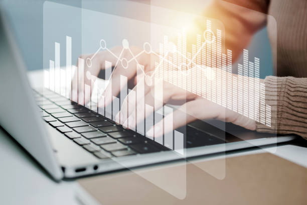 istock business woman working on laptop computer on desk with graphic graph chart diagram, security technology, financial, stock market, online marketing, business strategy, finance and technology concept 1320133215