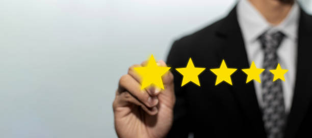 istock High quality. business man customer hand pointing on five star button on visual screen to review good rating, digital marketing, good experience, positive thinking and customer feedback concept 1320133227