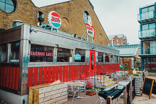 London, UK - 21 May, 2021: exterior architecture of an American-style diner in the docklands area of London, UK.