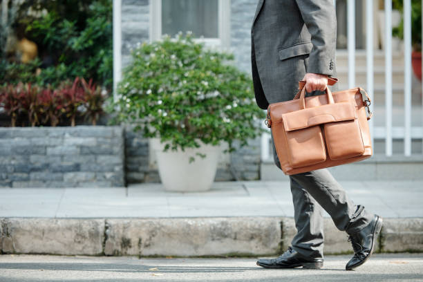 istock Unrecognizable man carrying briefcase outdoors 1320135734