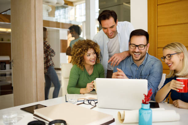 istock Business team brainstorming while using laptop in an office 1320135881