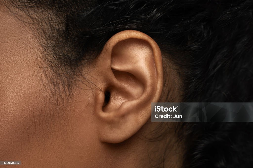Closeup view of black female ear Body parts in details - Closeup view of black female ear Ear Stock Photo