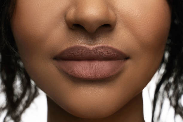 istock Close-up of beautiful black female lips 1320136224
