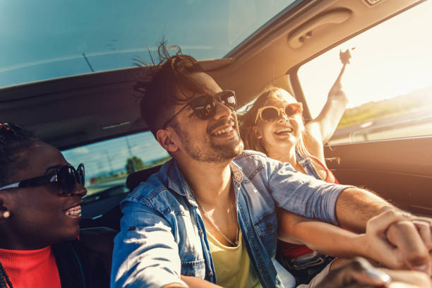 istock Three best friends enjoying traveling in the car. 1320137595