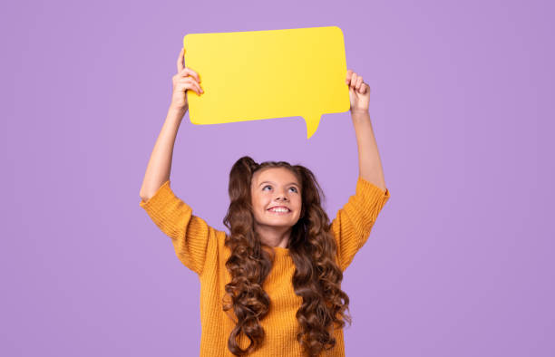 istock Cheerful girl with speech bubble 1320137751
