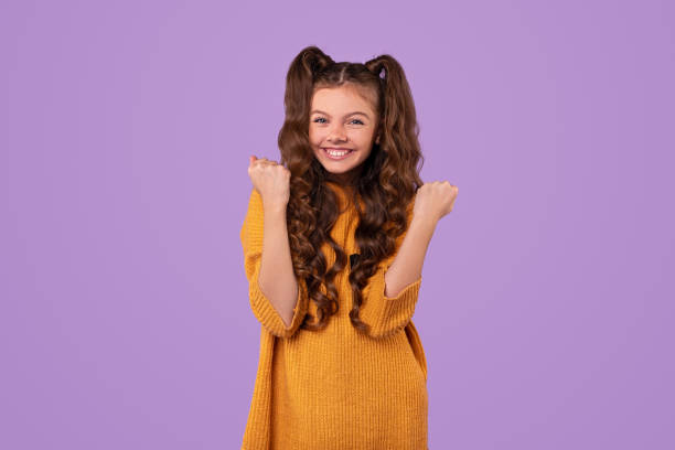 istock Happy girl smiling and celebrating victory 1320137767