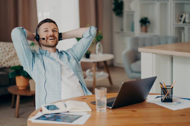istock Happy guy with headset with microphone enjoying online video chat 1320138760