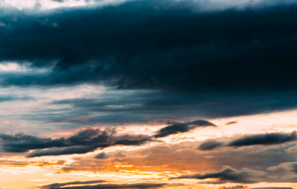 istock Dramatic gray, blue and orange sunset on beautiful sky, free space. Sky background on sunset with clouds 1320139167