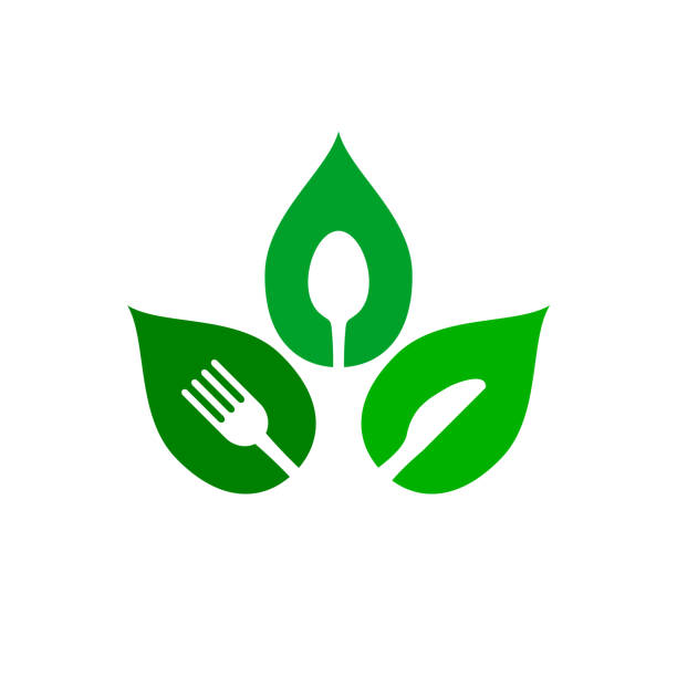 wegańskie logo żywności. widelec, nóż, łyżka wewnątrz zielonego liścia. - spoon vegetable fork plate stock illustrations