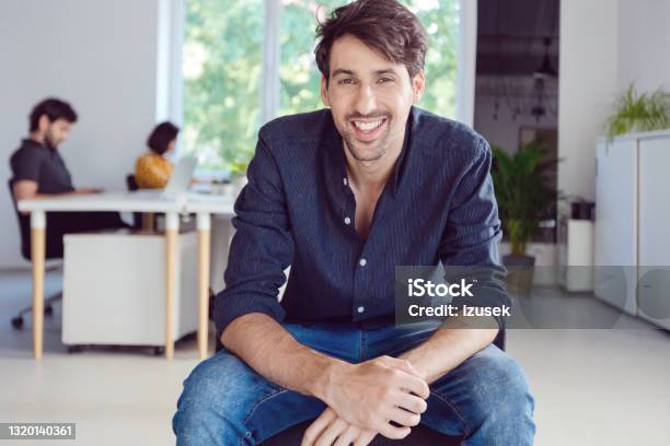 Portrait Of Man In The Office Stock Photo - Download Image Now - Laughing, Portrait, Manager