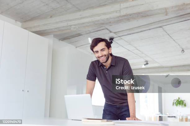 Cheerful Man In The Office Stock Photo - Download Image Now - Polo Shirt, Men, Portrait