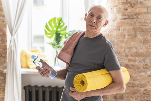 istock Active elderly man with is ready for his fitness workout at home 1320141307