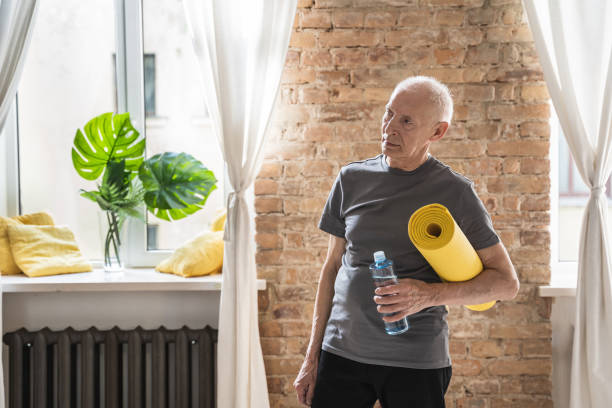 istock Active elderly man with is ready for his fitness workout at home 1320141323