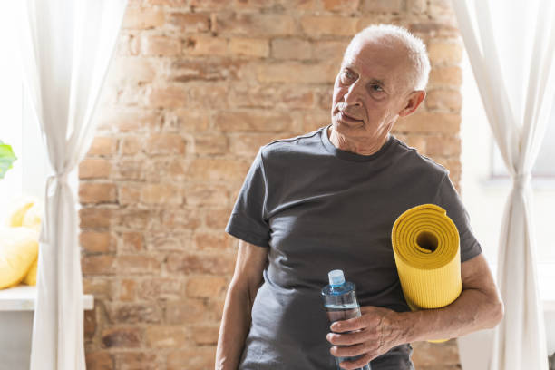 istock Active elderly man with is ready for his fitness workout at home 1320141340