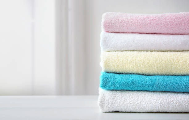 istock Stack of colorful terry towels empty space design. Colorful laundry.Household. 1320141346