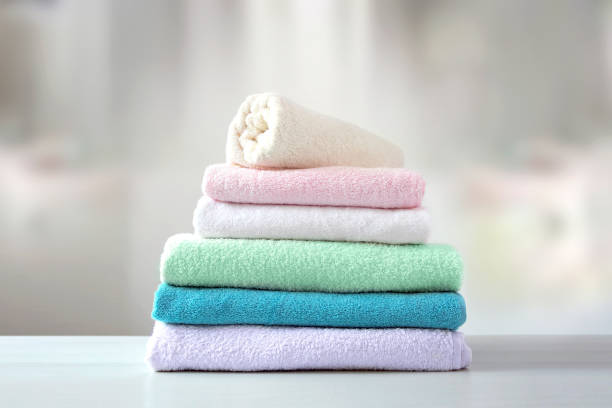 istock Towels folded stack.Colorful linen.Household. Laundry pile.Shower items. Hygiene concept. 1320141352